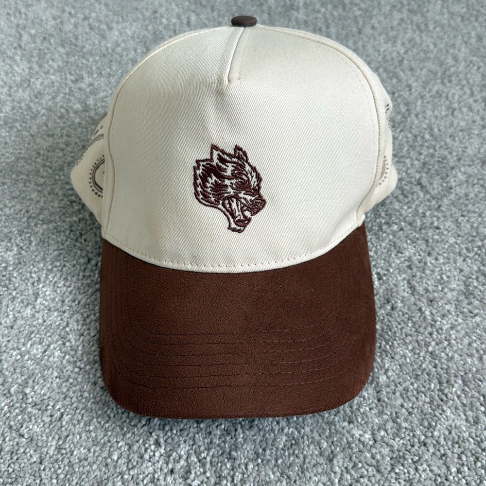 Darc sport cream and burnt orange hat